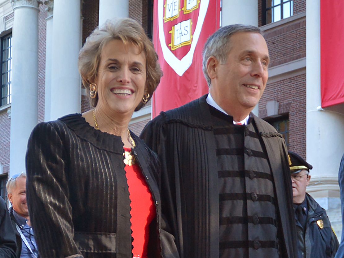 Lawrence Bacow, right, and his wife Adele Fleet Bacow leave Harvard Yard after his inauguration as the 29th President of Harvard University, Friday, Oct. 5, 2018 in Cambridge, Mass.