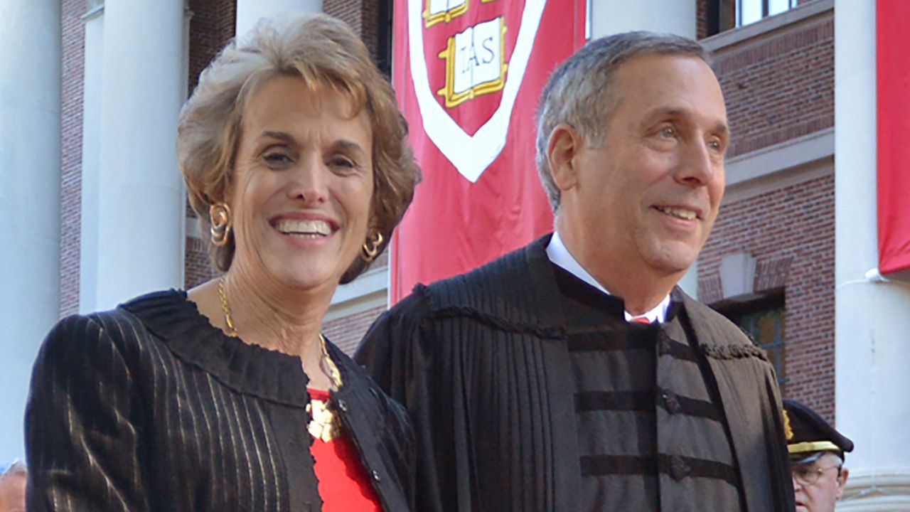 Lawrence Bacow, right, and his wife Adele Fleet Bacow leave Harvard Yard after his inauguration as the 29th President of Harvard University, Friday, Oct. 5, 2018 in Cambridge, Mass.