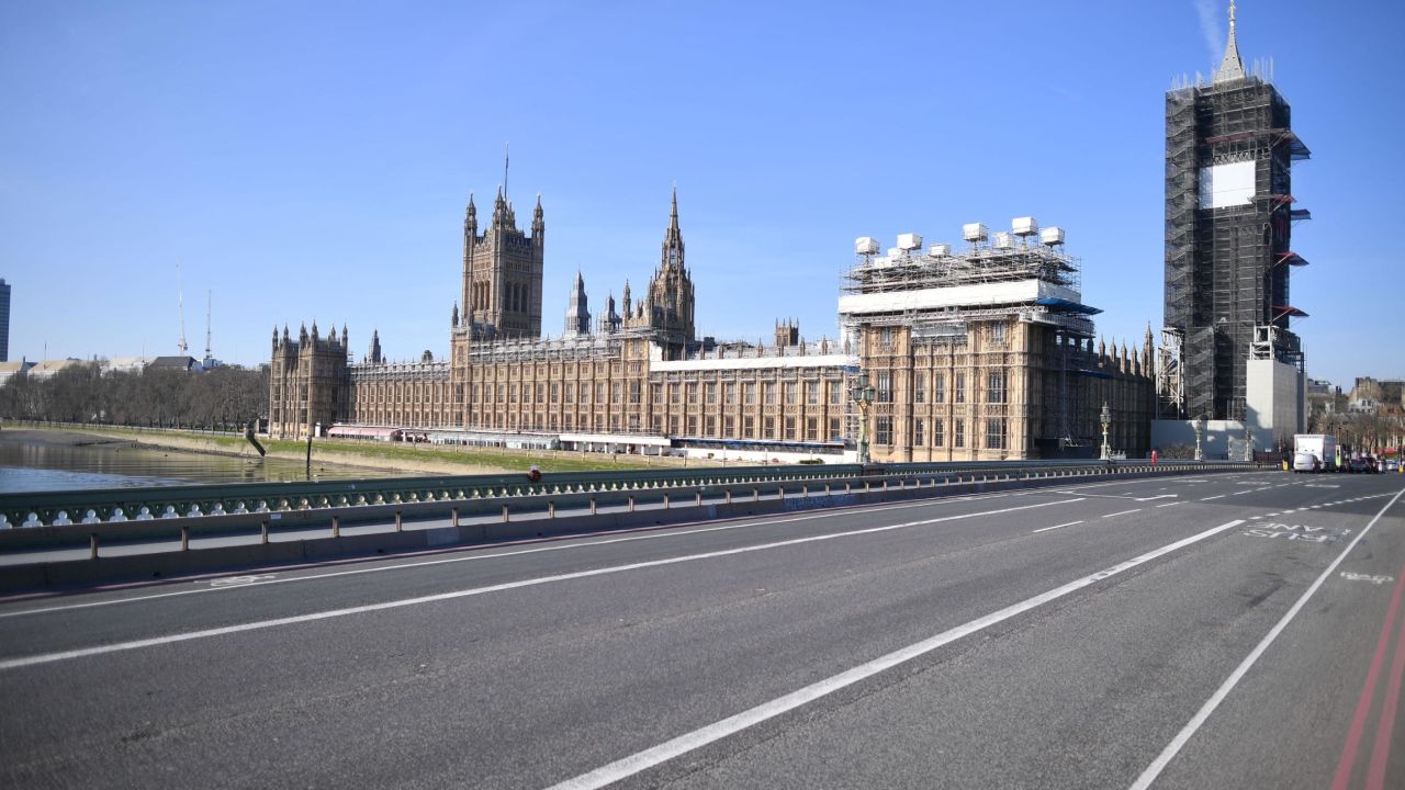 A picture shows the Houses of Parliament (L) at the end of an empty Westminster Bridge in central London in the morning on March 24, 2020 after Britain ordered a lockdown to slow the spread of the novel coronavirus. - Britain was under lockdown March 24, its population joining around 1.7 billion people around the globe ordered to stay indoors to curb the "accelerating" spread of the coronavirus. (Photo by JUSTIN TALLIS / AFP) (Photo by JUSTIN TALLIS/AFP via Getty Images)