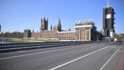 A picture shows the Houses of Parliament (L) at the end of an empty Westminster Bridge in central London in the morning on March 24, 2020 after Britain ordered a lockdown to slow the spread of the novel coronavirus. - Britain was under lockdown March 24, its population joining around 1.7 billion people around the globe ordered to stay indoors to curb the "accelerating" spread of the coronavirus. (Photo by JUSTIN TALLIS / AFP) (Photo by JUSTIN TALLIS/AFP via Getty Images)