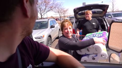A grateful recipient gets the gift of toilet paper from Scites and Stuart's stash.