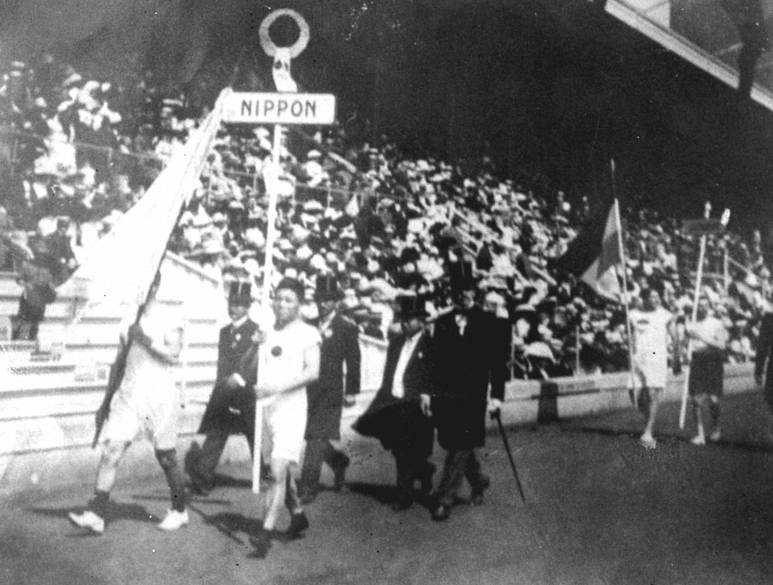 The Japanese athletic delegation marches during the opening ceremony of the 1912 Olympic Games in Stockholm, Sweden, which marked Japan's first Olympic appearance. The sign holder was marathon runner Shiso Kanaguri (R front) and the flag bearer was sprinter Yahiko Mishima (L front). (Photo by Kyodo News Stills via Getty Images)