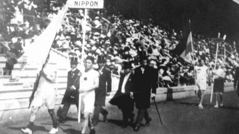 The Japanese athletic delegation marches during the opening ceremony of the 1912 Olympic Games in Stockholm, Sweden, which marked Japan's first Olympic appearance. The sign holder was marathon runner Shiso Kanaguri (R front) and the flag bearer was sprinter Yahiko Mishima (L front). (Photo by Kyodo News Stills via Getty Images)