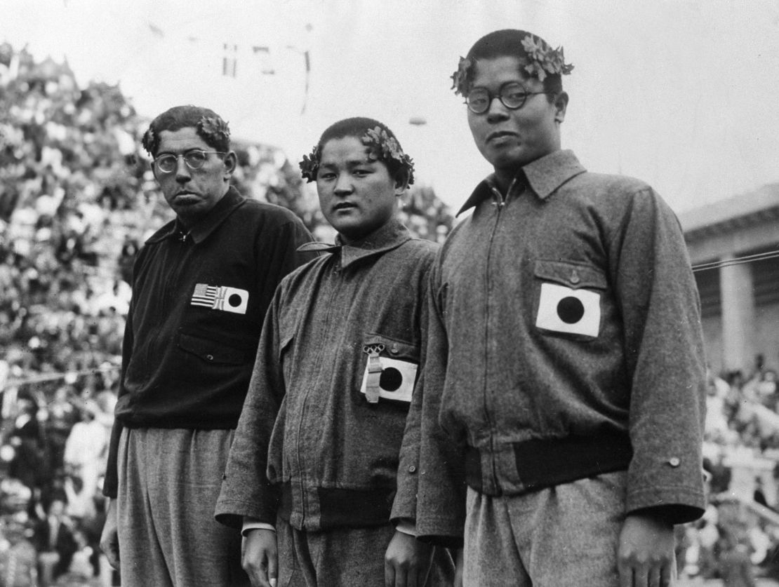 (L to R) Silver medalist Jack Medica of the United States, gold medalist Noboru Terada of Japan and bronze medalist Shumpei Uto of Japan pose on the podium during the medal ceremony for Swimming Men's 1,500m Freestyle during the Berlin Olympic at Swimming Stadium on August 15, 1936 in Berlin, Germany.  (Photo by The Asahi Shimbun via Getty Images)