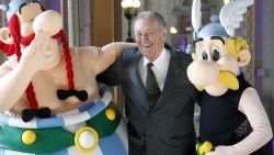 PARIS, FRANCE - MARCH 25: Cartoonist Albert Uderzo of France poses with Asterix (R) and Obelix (L) prior to a press conference at the Monnaie de Paris on March 25, 2015, in Paris, France. A new twelve piece coin series illustrated with Asterix entitled "Asterix and the values of the Republic" was presented in Paris. (Photo by Chesnot/Getty Images)