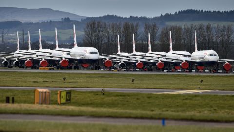A grounded fleet of British Airway planes sit on the runway at Glasgow Airport.