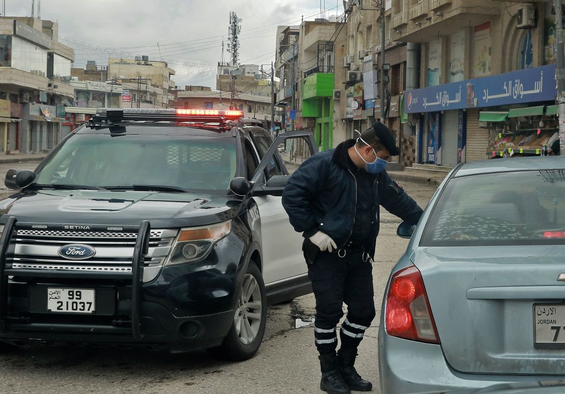 A policeman speaks to a driver at a checkpoint in Amman on Saturday.