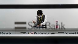 OSAKA, JAPAN - MARCH 14: An employee wearing a face mask works in a SoftBank store on March 14, 2020 in Osaka, Japan. Excluding the Diamond Princess cruise ship cases, the number of coronavirus infections in Japan reached 714 on Saturday as United States President Donald Trump suggested the Tokyo Olympics should be postponed to next year.  (Photo by Tomohiro Ohsumi/Getty Images)