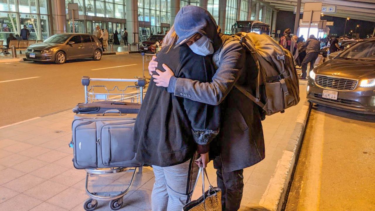 Eihab Boraie hugs his mom farewell at Cairo's international airport.