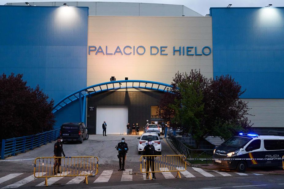 Authorities are seen in Madrid, where an <a href="https://edition.cnn.com/2020/03/24/europe/spain-ice-rink-morgue-coronavirus-intl/index.html" target="_blank">ice rink was converted into a makeshift morgue</a> to cope with the coronavirus fallout.