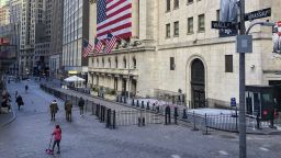 Passersby in front of the New York Stock Exchange. 