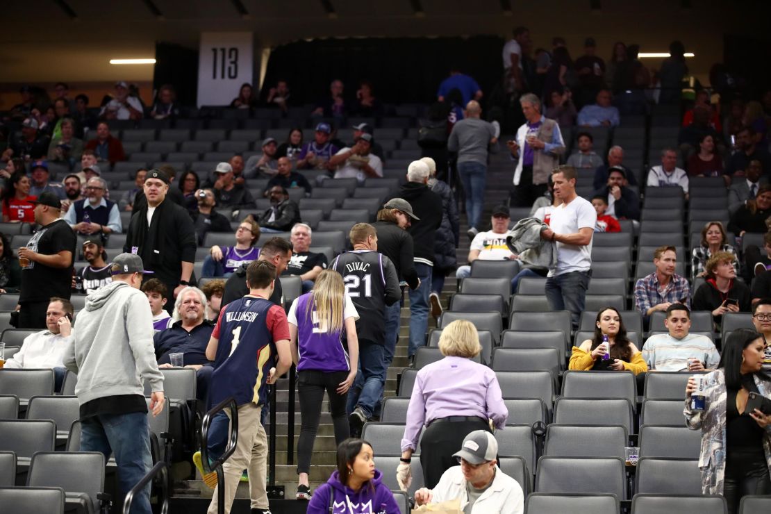 Fans exit after the Sacramento King game against the New Orleans Pelicans was postponed due to the corona virus at on March 11 in Sacramento, California.