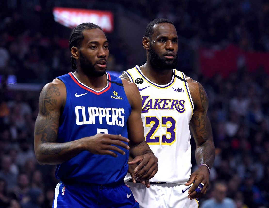 Kawhi Leonard #2 of the LA Clipper and LeBron James #23 of the Los Angeles Lakers during the first half at Staples Center on March 08, 2020 in Los Angeles, California.