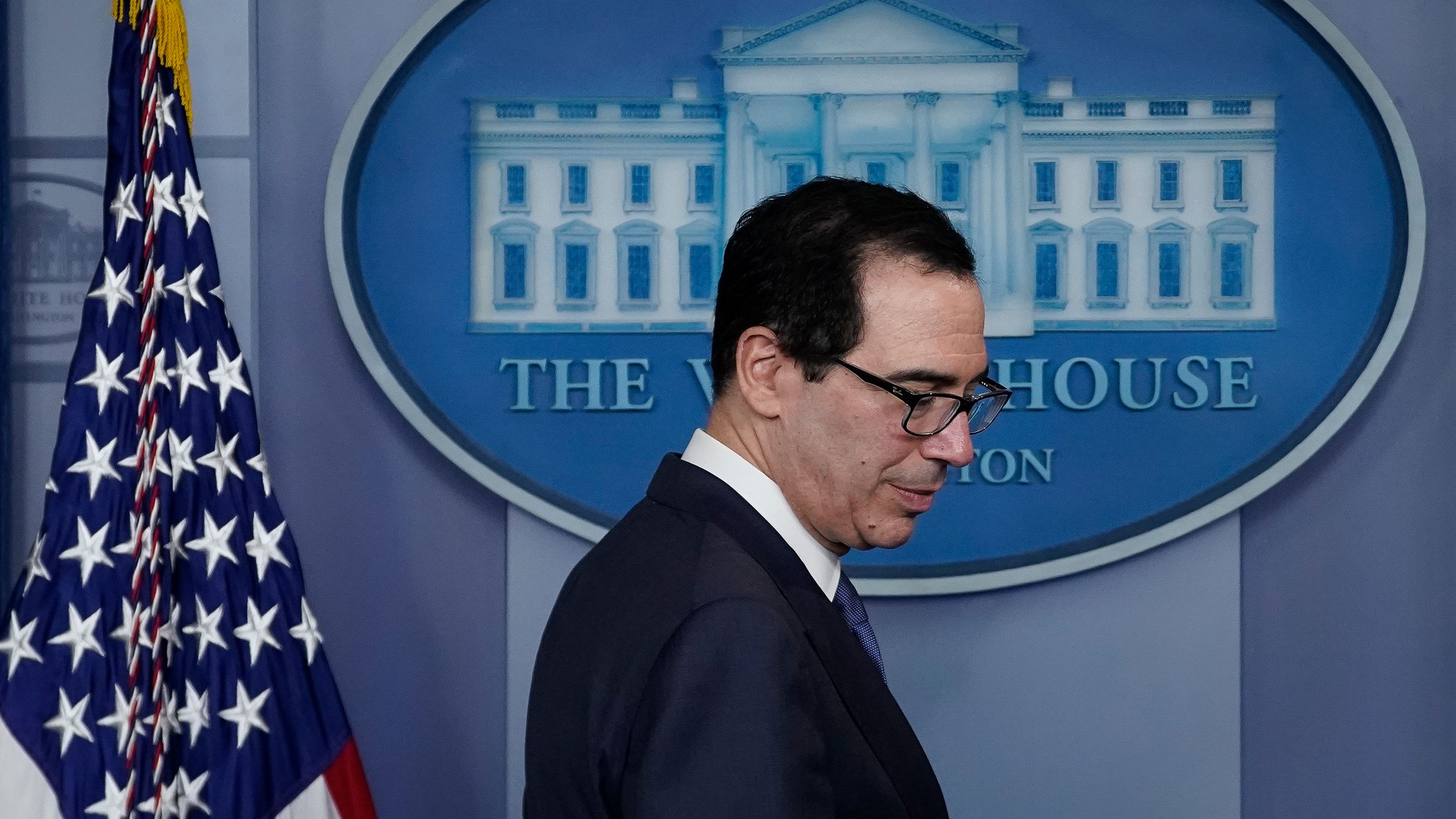 Treasury Secretary Steven Mnuchin arrives for a briefing on the coronavirus pandemic, in the press briefing room of the White House on March 25, 2020. (Photo by Drew Angerer/Getty Images)