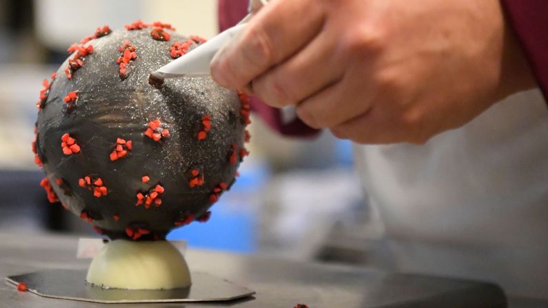 <strong>Decorative touches:</strong> The chocolate eggs are painted black and dotted with red-painted almonds to replicate how the virus looks under a microscope.