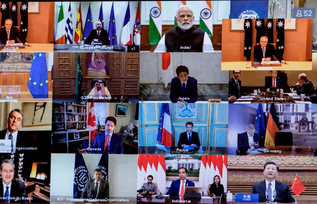 Australian Prime Minister Scott Morrison (Top-R) is seen on a screen attending a videoconference with G20 leaders to discuss the COVID-19 coronavirus, at the Parliament House in Canberra on March 26, 2020. 