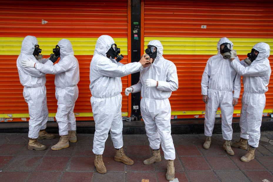 Members of Iran's Revolutionary Guard prepare to take part in disinfecting the city of Tehran on March 25, 2020. 