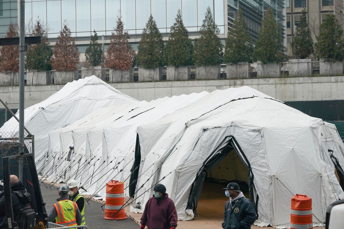 Workers build a makeshift morgue outside of Bellevue Hospital in Manhattan.