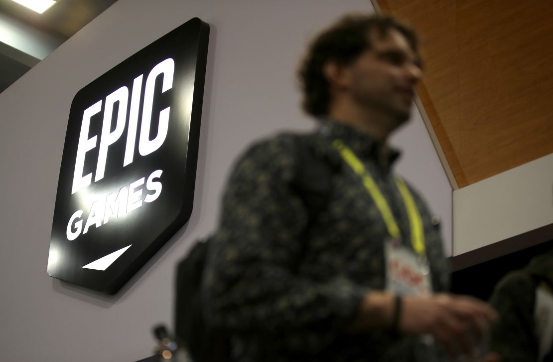Attendees walk by the Epic Games booth at the 2019 GDC Game Developers Conference on March 20, 2019 in San Francisco.