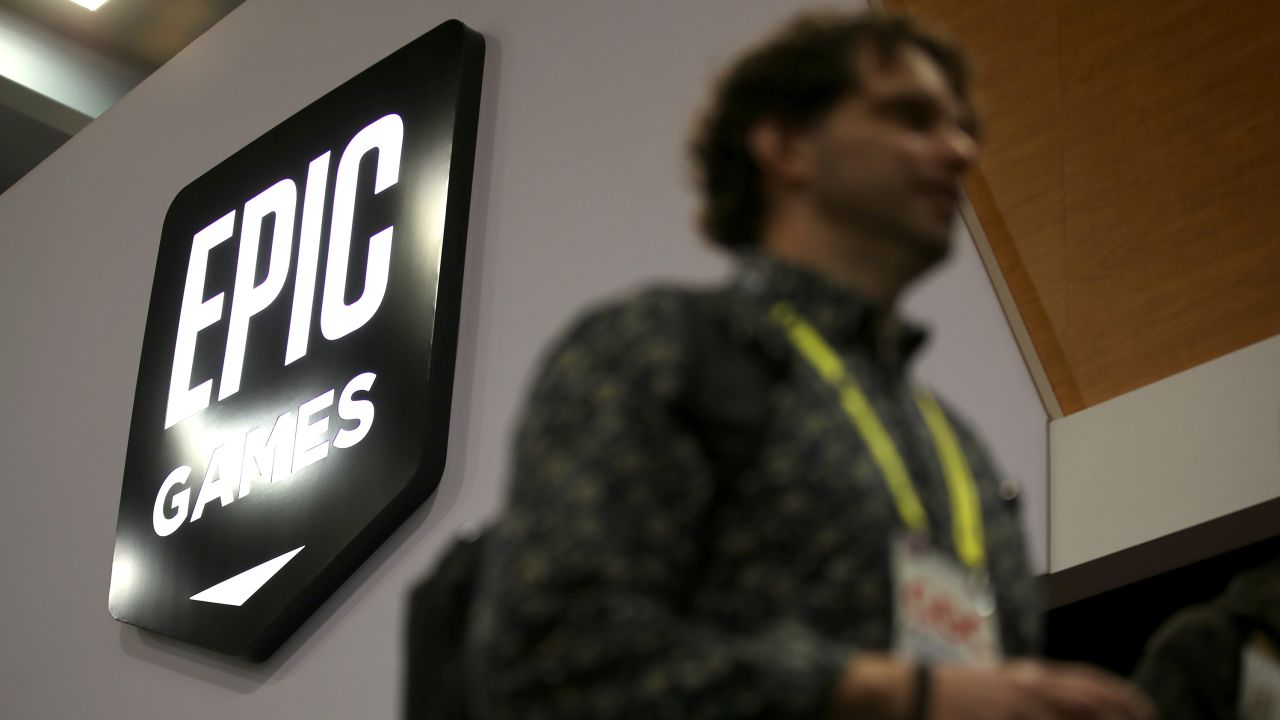 Attendees walk by the Epic Games booth at the 2019 GDC Game Developers Conference on March 20, 2019 in San Francisco.