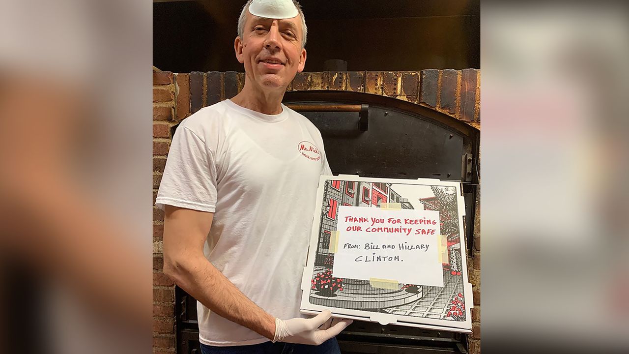 Nick Krasniqi of Mr. Nick's Brick Oven Pizza standing with one of the pizzas that were delivered to Phelps Memorial Hospital. 