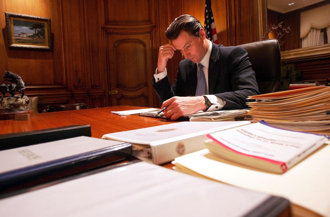 San Francisco Mayor Gavin Newsom writes a speech in his office at City Hall in San Francisco in January 2005. 