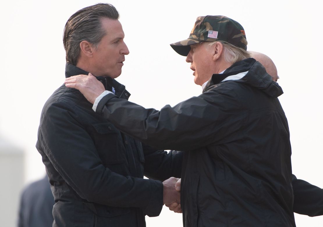 President Donald Trump, right, greets California Gov.-elect Gavin Newsom as he prepares to tour wildfire damage in California on November 17, 2018.