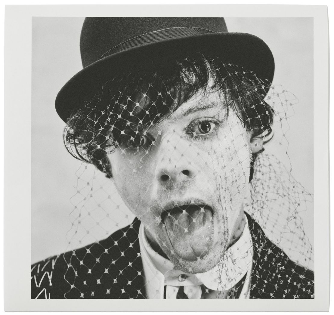 Harry Styles in a bowler hat and veil for a Beauty Papers 