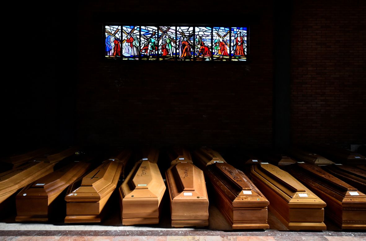 Coffins carrying coronavirus victims are seen at a church in Alessandria, Italy, on Monday, March 23.