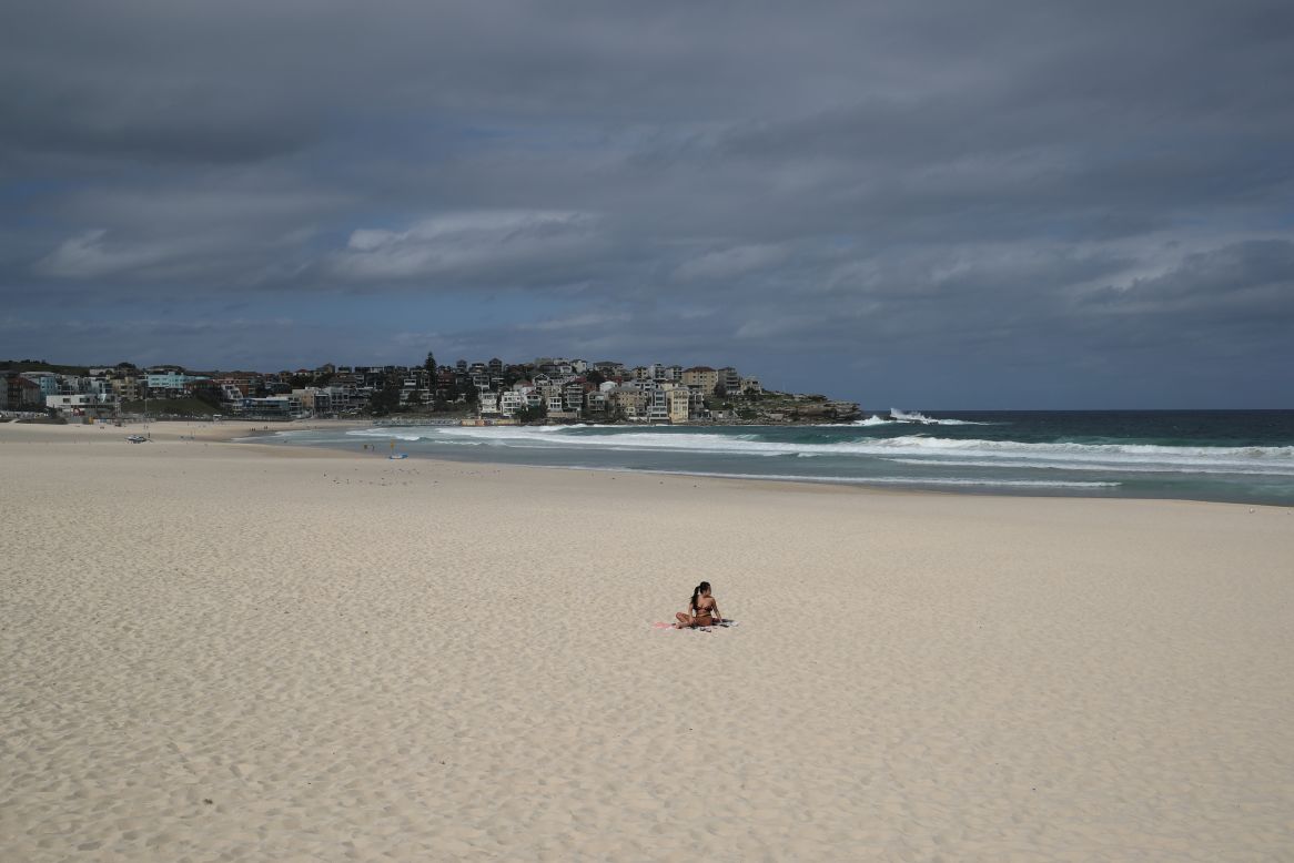 A single sunbather remains on Sydney's Bondi Beach on Saturday, March 21. The beach was closed to prevent the spread of the coronavirus.