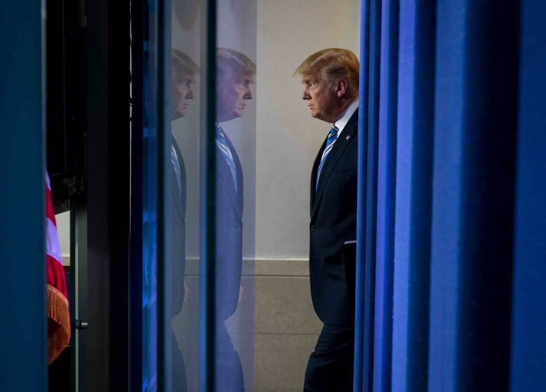 President Donald Trump arrives for a daily coronavirus briefing at the White House on Monday, March 23.