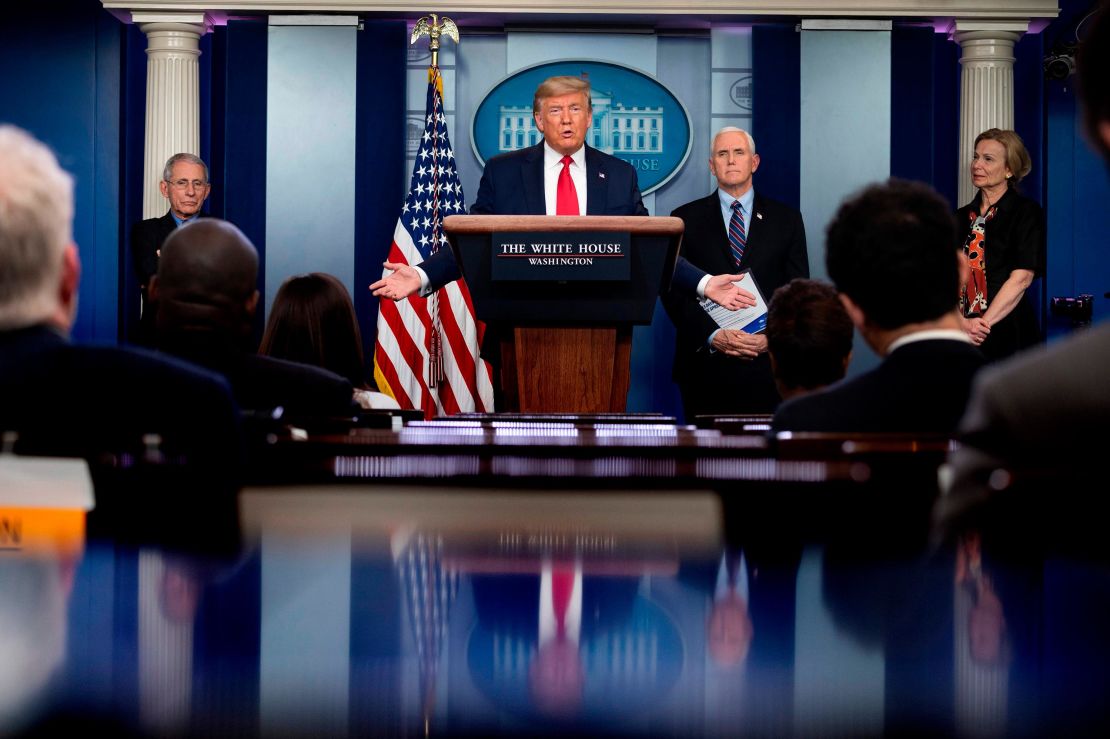 US President Donald Trump, flanked by (From L) Director of the National Institute of Allergy and Infectious Diseases Anthony Fauci, US Vice President Mike Pence and Response coordinator for White House Coronavirus Task Force Deborah Birx, speaks during the daily briefing on the novel coronavirus, COVID-19, in the Brady Briefing Room at the White House on March 26, 2020, in Washington, DC.