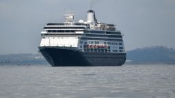 The Zaandam cruise ship enters the Panama City Bay to be assisted by the Rotterdam cruise ship with supplies, personnel and COVID-19 testing devices, at 8 milles from Panama City, on March 27, 2020. - Panama allowed medical assistance at sea for the Zaandam cruise ship with dozens of people with flu symptoms on board amid the coronavirus pandemic outbreak, but denied the Dutch-flagged cruiser Zaandam transit through the Panama Canal, announced the administrator of the maritime route, Ricaurte Vásquez, who also said that the ship will be quarantined if any case of the new coronavirus is confirmed on board. (Photo by Luis Acosta / AFP) (Photo by LUIS ACOSTA/AFP via Getty Images)