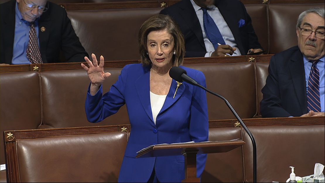 In this image from video, House Speaker Nancy Pelosi addresses the House of Representatives after wiping down the microphone.