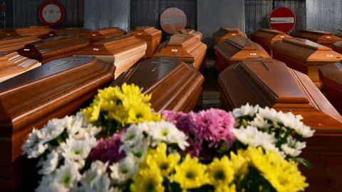 Some of the 35 coffins of people who died of coronavirus are stored in a warehouse in Ponte San Pietro, near Bergamo, Lombardy, waiting to be taken to another region of Italy for cremation.