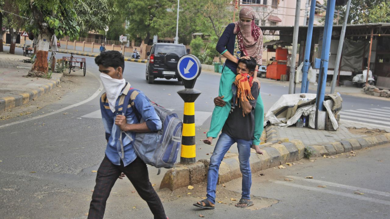 Migrant workers from the state of Rajasthan leaving for their village after the city of Ahmedabad comes under lock down on Thursday, March 26.