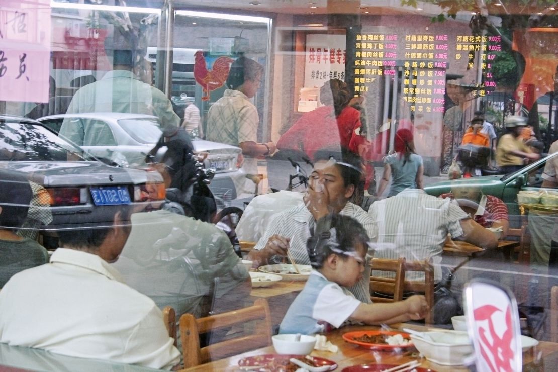 The first image in Stünkel's series was taken in a restaurant window in Shanghai.