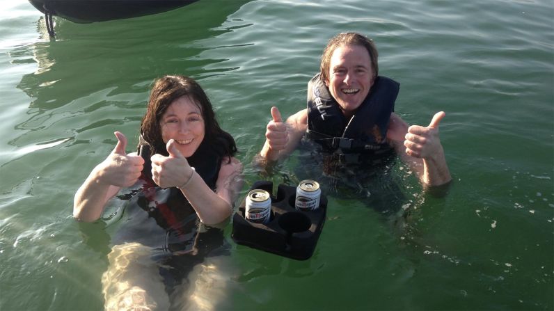 <strong>Brewskis and jet skis:</strong> Senior Producer Maureen O'Hare and her brother, Thomas, sit back in their swim vests at their floating bar in the waters off Sant Carles de la Ràpita in Spain in 2016. It was almost Halloween, but the skies were blue and the water warm. 