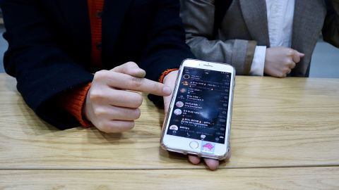 Kwon and Ahn, the two university students, show a chat room set up to monitor Cho Joo-bin's activities on Telegram