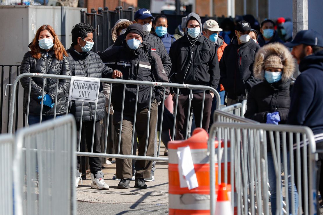 Patients wait for coronavirus testing outside Elmhurst Hospital Center in New York on Friday. 