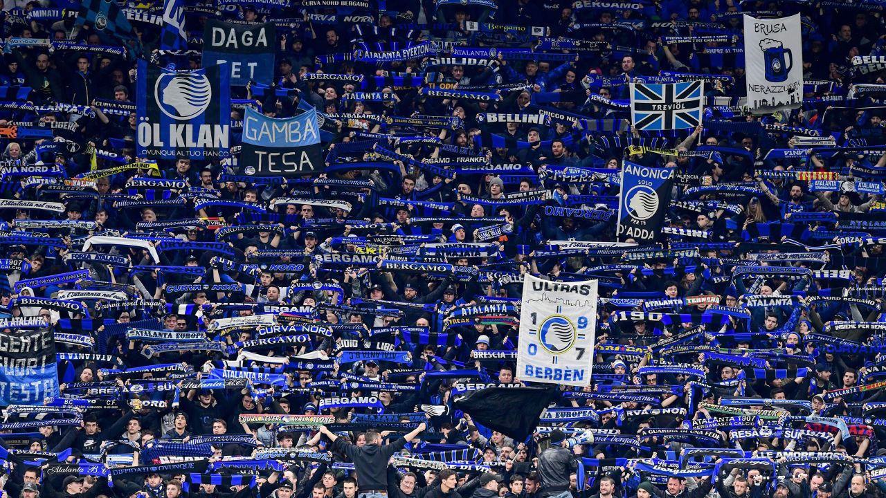 Atalanta fans cheer during a Champions League match between their team and Valencia on February 19 in Milan. 