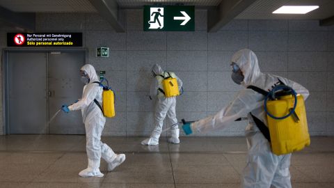 Members of the Military Emergencies Unit (UME) carry out a general disinfection at Malaga airport on March 16, 2020. 