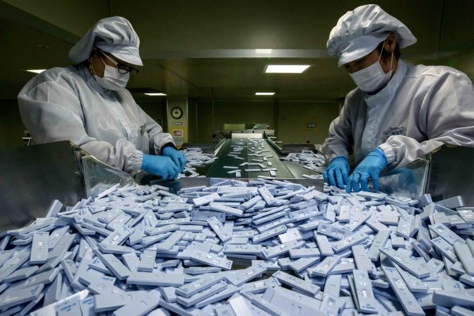 Devices used in diagnosing the coronavirus are inspected in Cheongju, South Korea, on March 27, 2020. The devices were being prepared for testing kits at the bio-diagnostic company SD Biosensor.