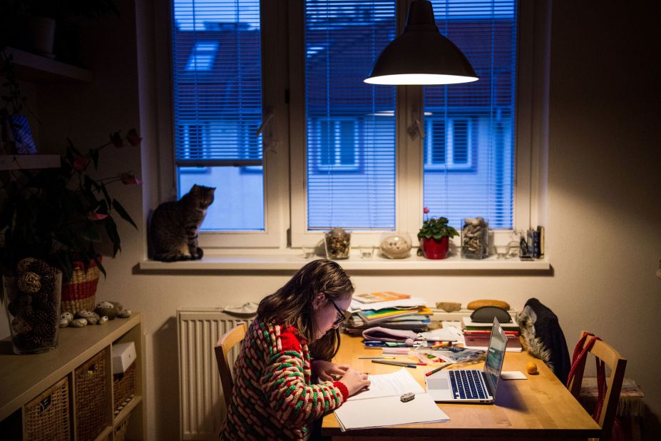 A student does homework in Bratislava, Slovakia, on March 27, 2020. Schools were shut down across the world, and many children have been receiving their lessons online.