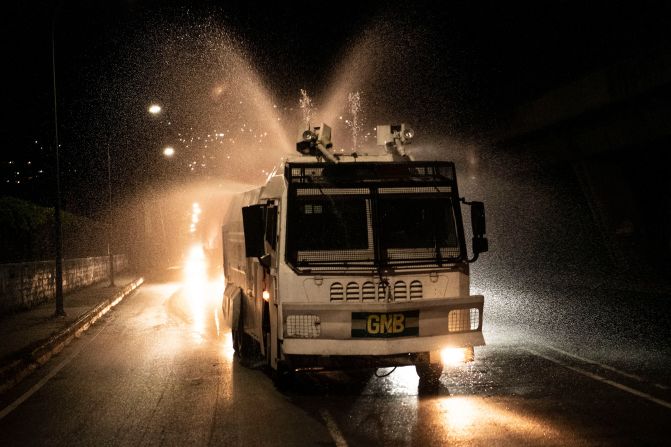 A National Guard truck sprays disinfectant in Caracas, Venezuela, on March 27, 2020.