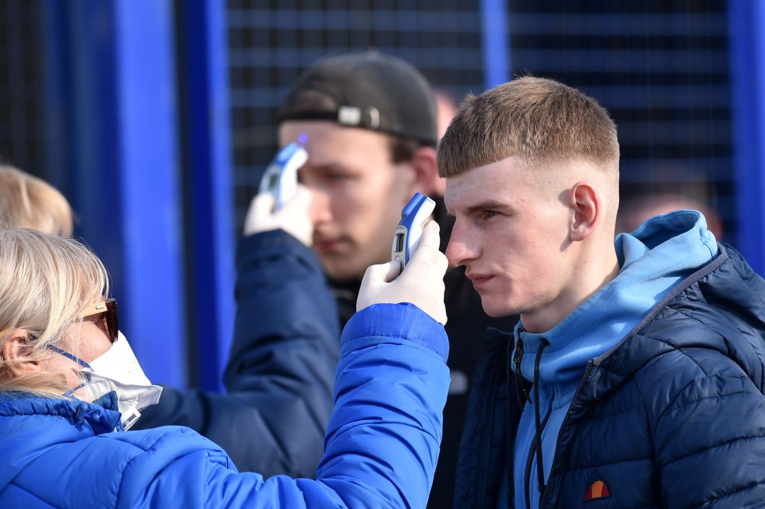 Fans have their temperatures checked before entering the stadium.