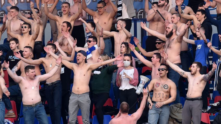 Fans of FC Minsk support their team during the Belarus Championship foolball match between FC Minsk and FC Dinamo-Minsk in Minsk, on March 28, 2020. - In stark contrast to leagues elsewhere on the European continent, the Belarus championship continues. (Photo by Sergei GAPON / AFP) (Photo by SERGEI GAPON/AFP via Getty Images)