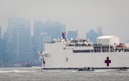 The Navy hospital ship USNS Comfort heads into New York, Monday March 30, 2020. (AP Photo/Bebeto Matthews)