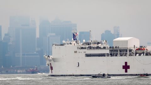 The Navy hospital ship USNS Comfort heads into New York, Monday March 30, 2020. (AP Photo/Bebeto Matthews)