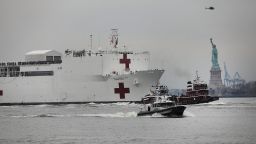NEW YORK, NY - MARCH 30: The USNS Comfort hospital ship travels up the Hudson River as it heads to Pier 90 on March 30, 2020 seen from Battery Park in New York City. The Comfort, a floating hospital in the form of a Navy ship, is equipped to take in patients within 24 hours but will not be treating people with COVID-19. The ship's 1,000 beds and 12 operation rooms will help ease the pressure on New York hospitals, many of which are now overwhelmed with COVID-19 patients.  (Photo by Spencer Platt/Getty Images)